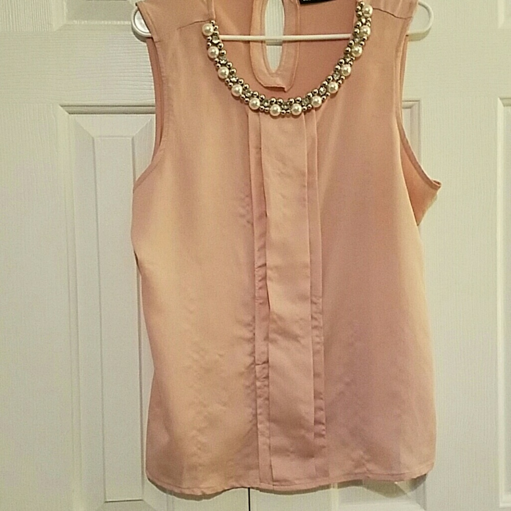 Light pink jeweled blouse